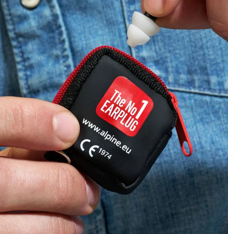 Cyclist wearing earplugs to protect from wind noise