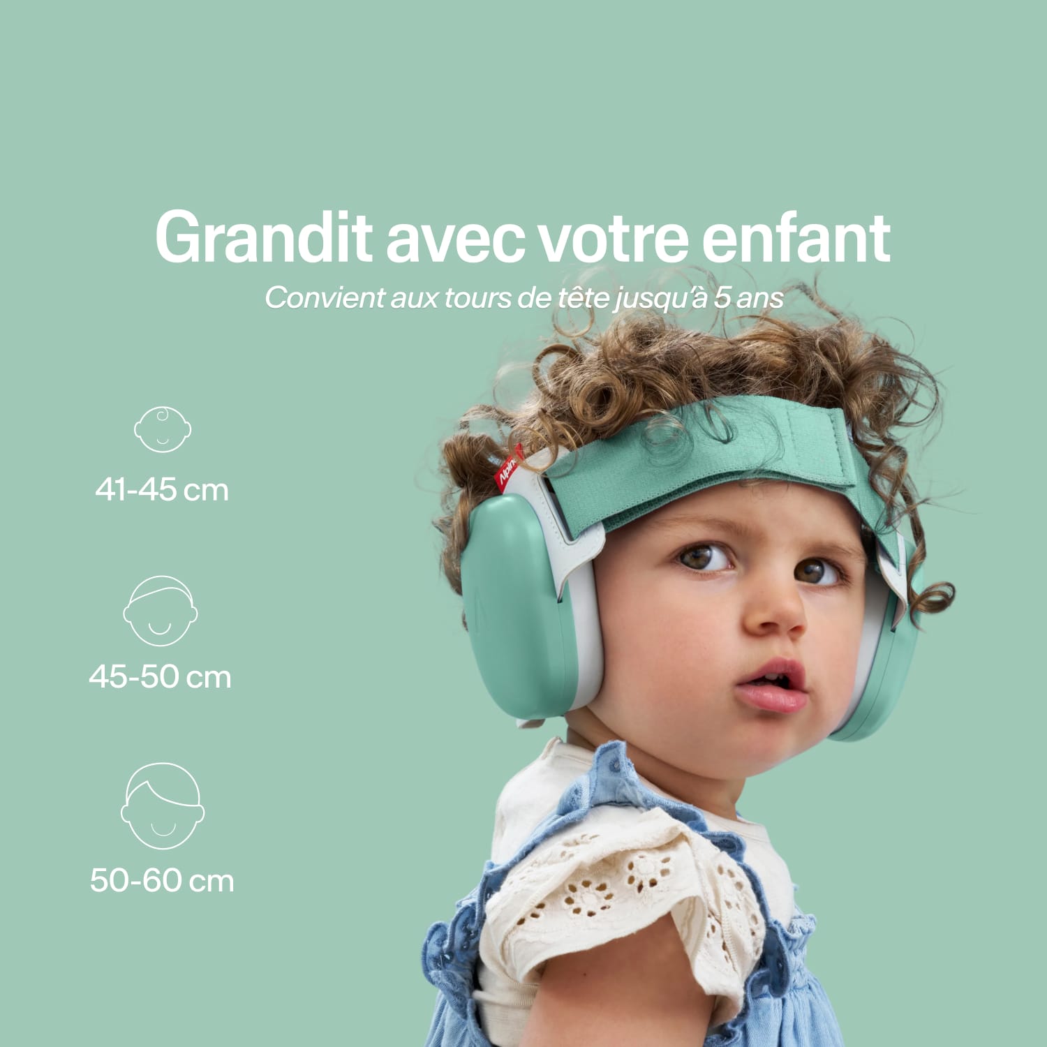 Child wearing a green helmet with size information on a light green background