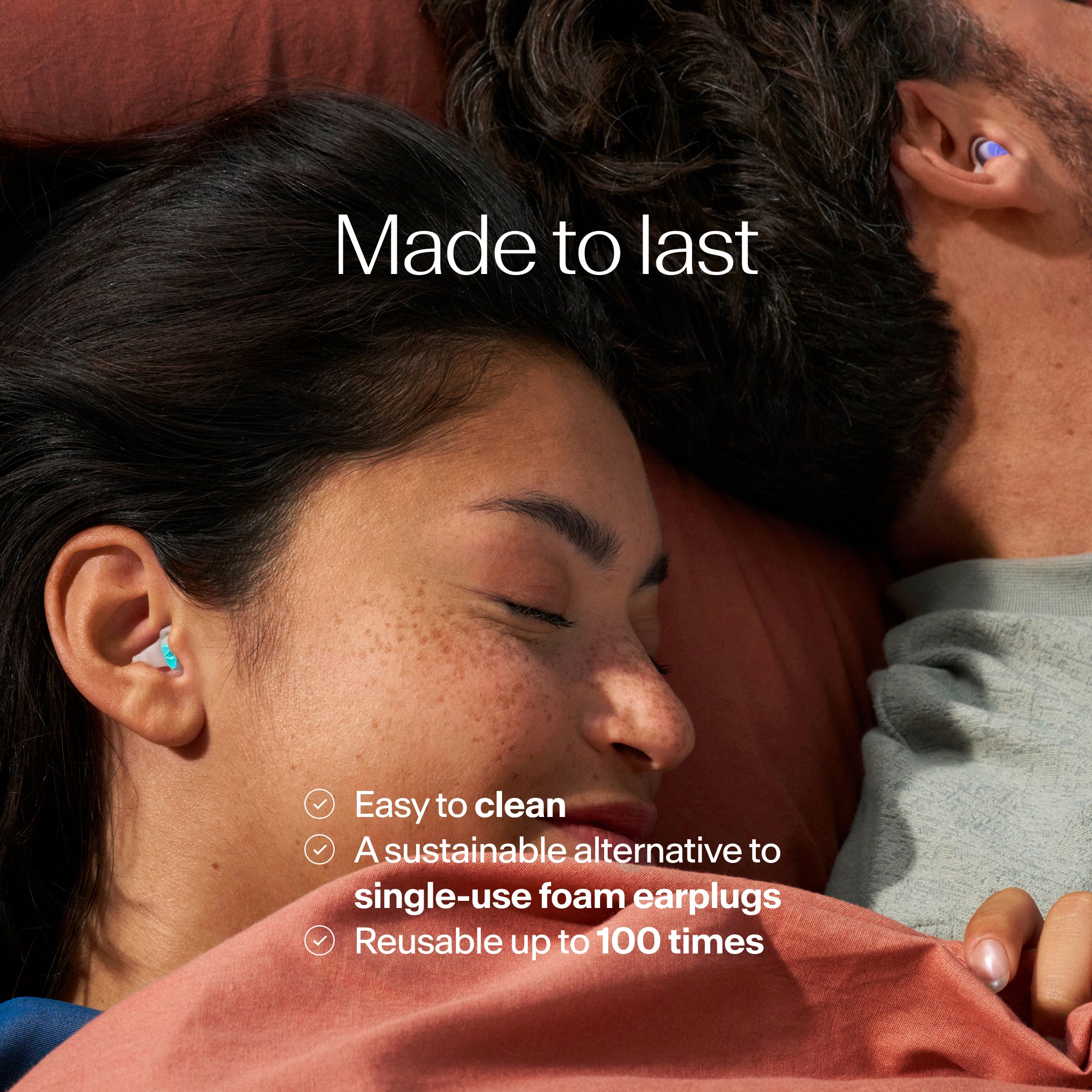 Close-up of a couple lying down with earplugs in their ears, text indicating features of the earplugs.