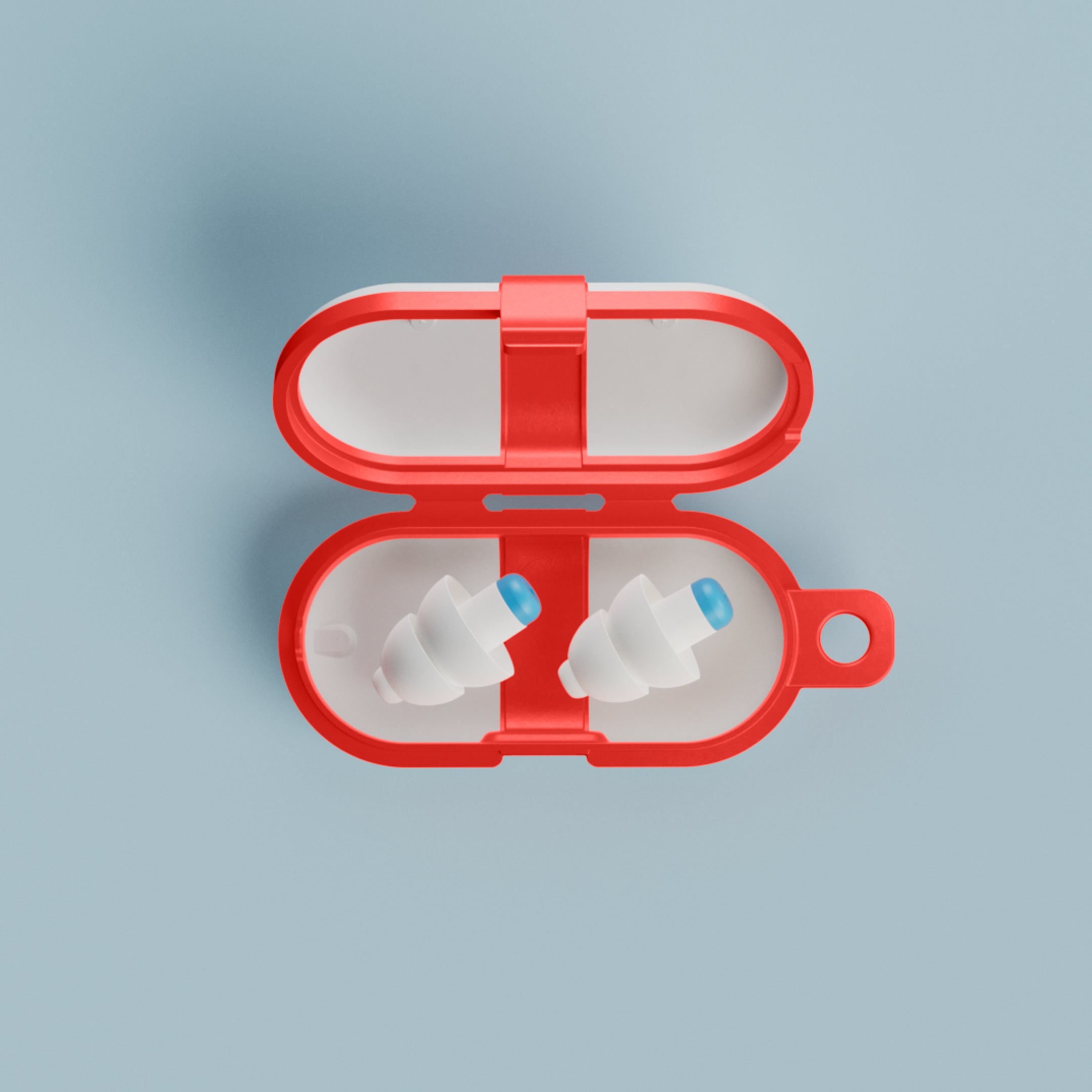 Pair of Alpine SwimSafe earplugs in an open red travel case, top view