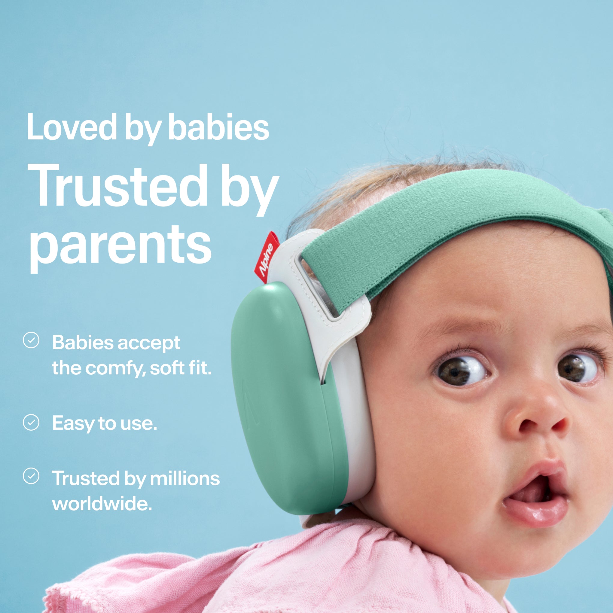 Baby wearing Alpine Muffy Baby in sage green on the head