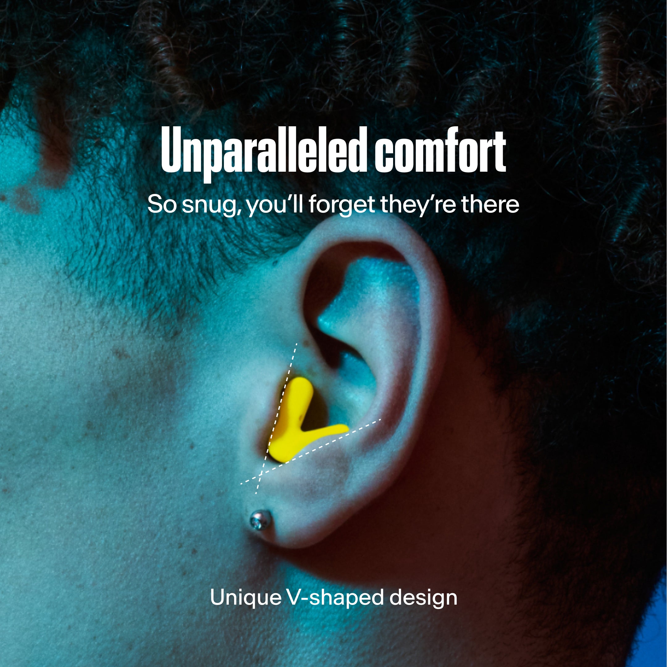 detailed image of an ear with an alpine tune earplug in neon-yellow showing the snug fit in ear