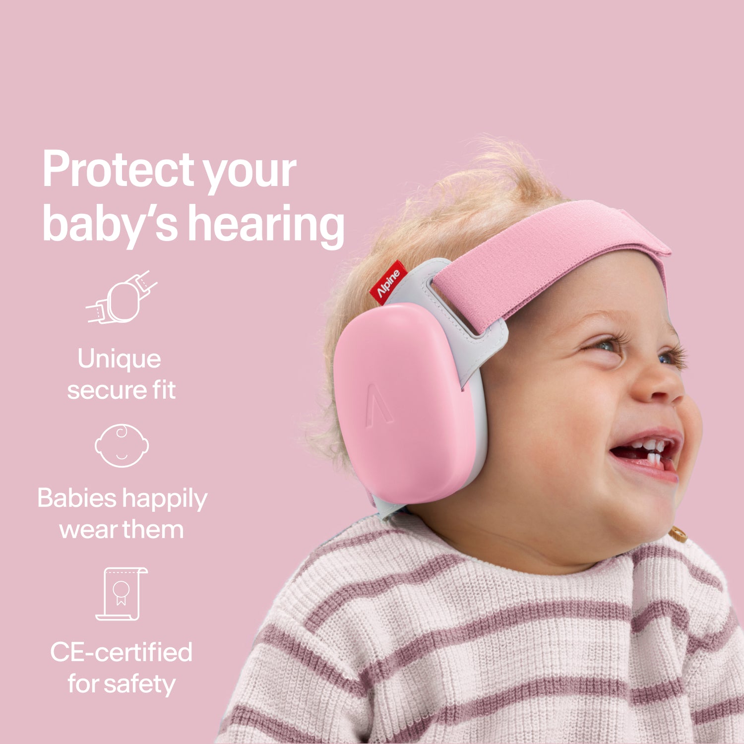 : Happy baby wearing rose-pink Alpine ear muffs with secure fit, CE-certified hearing protection 