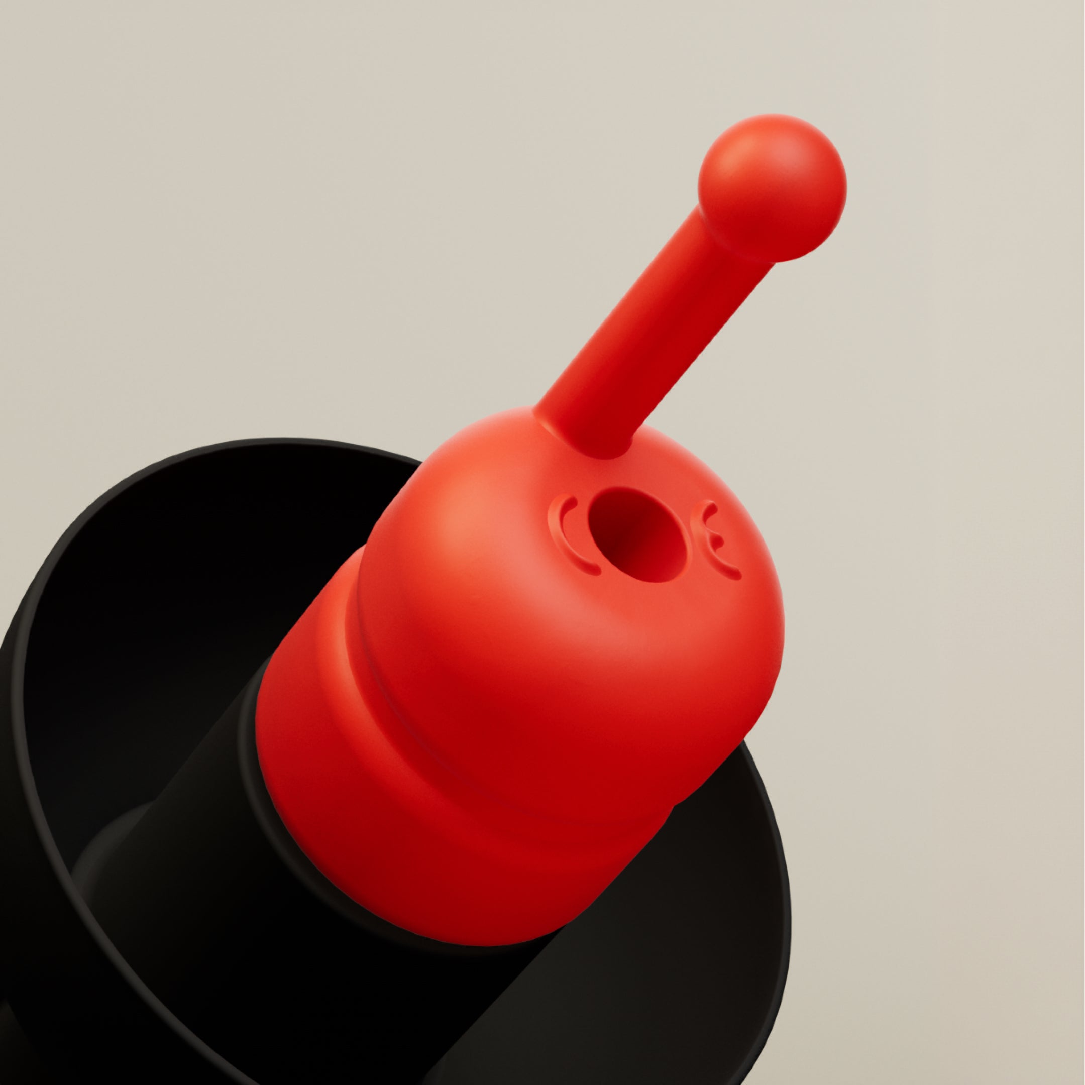 Close-up of the red filter with central opening and pull stem on an Alpine MotoGP™ earplug 