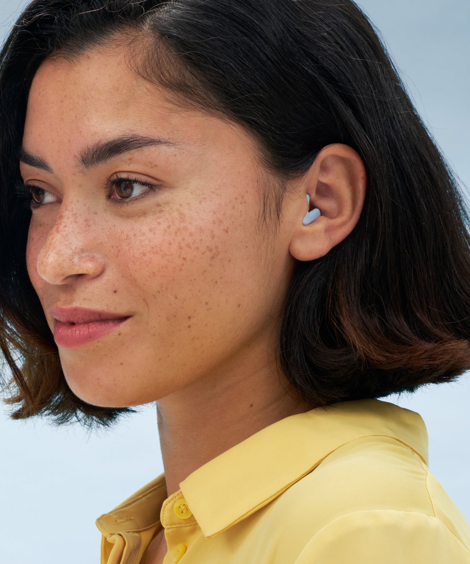 Girl wearing blue silence earplugs