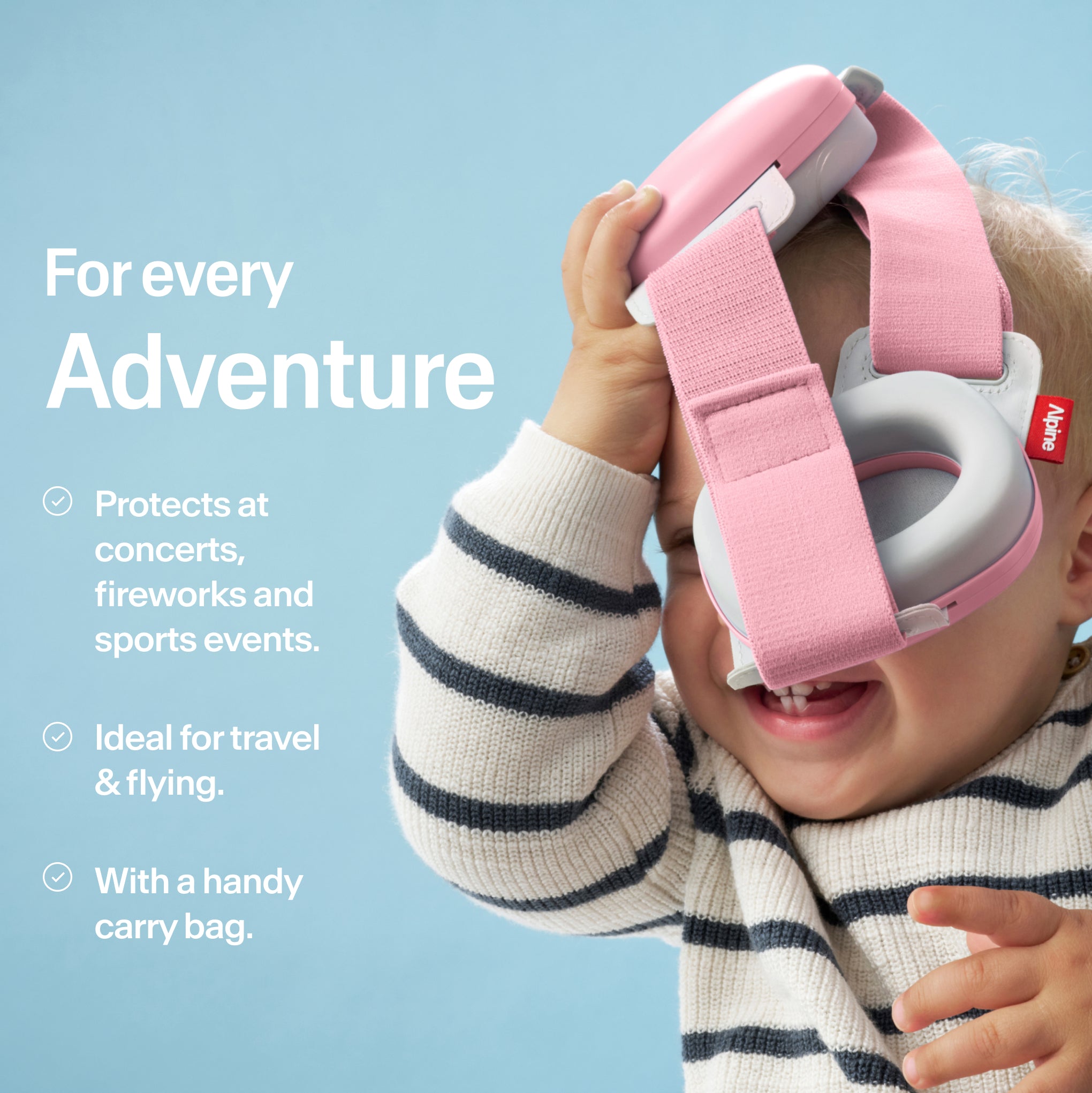 Baby holding Alpine Muffy Baby in rose pink in hand with USPs for use #color_rose-pink