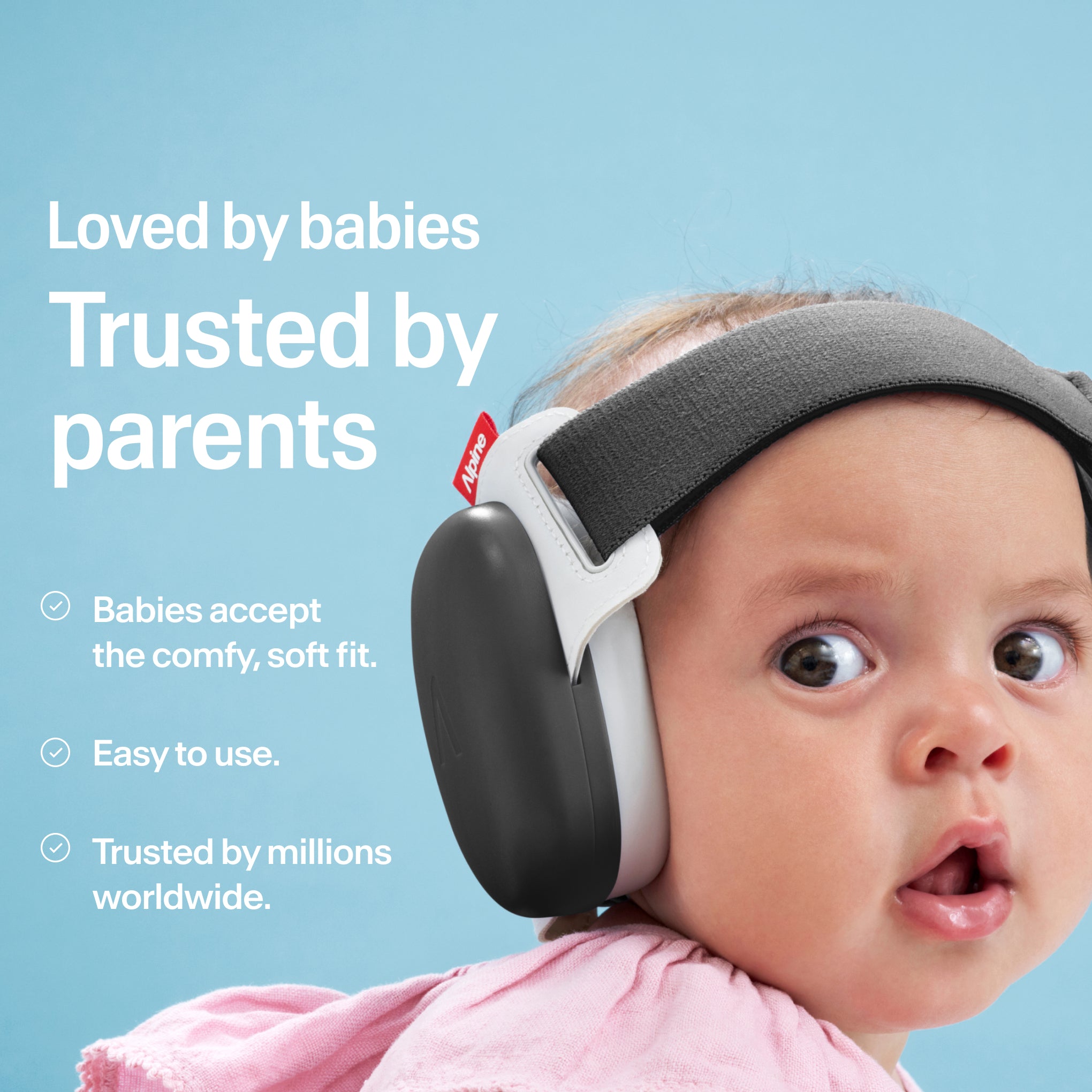 Baby wearing Alpine Muffy Baby in black on the head 