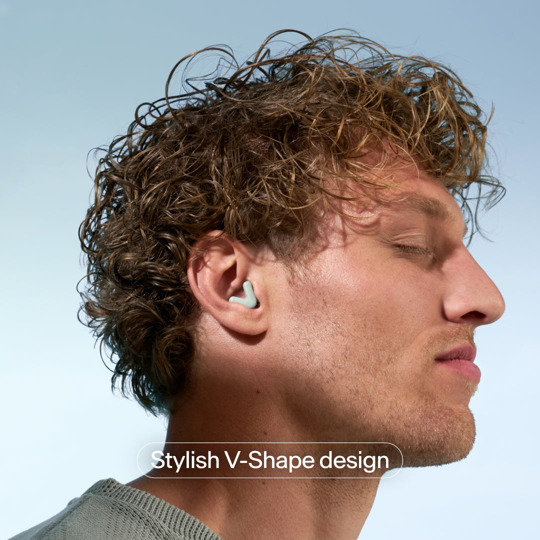 V-shape Alpine Silence earplugs in ear – green #color_green