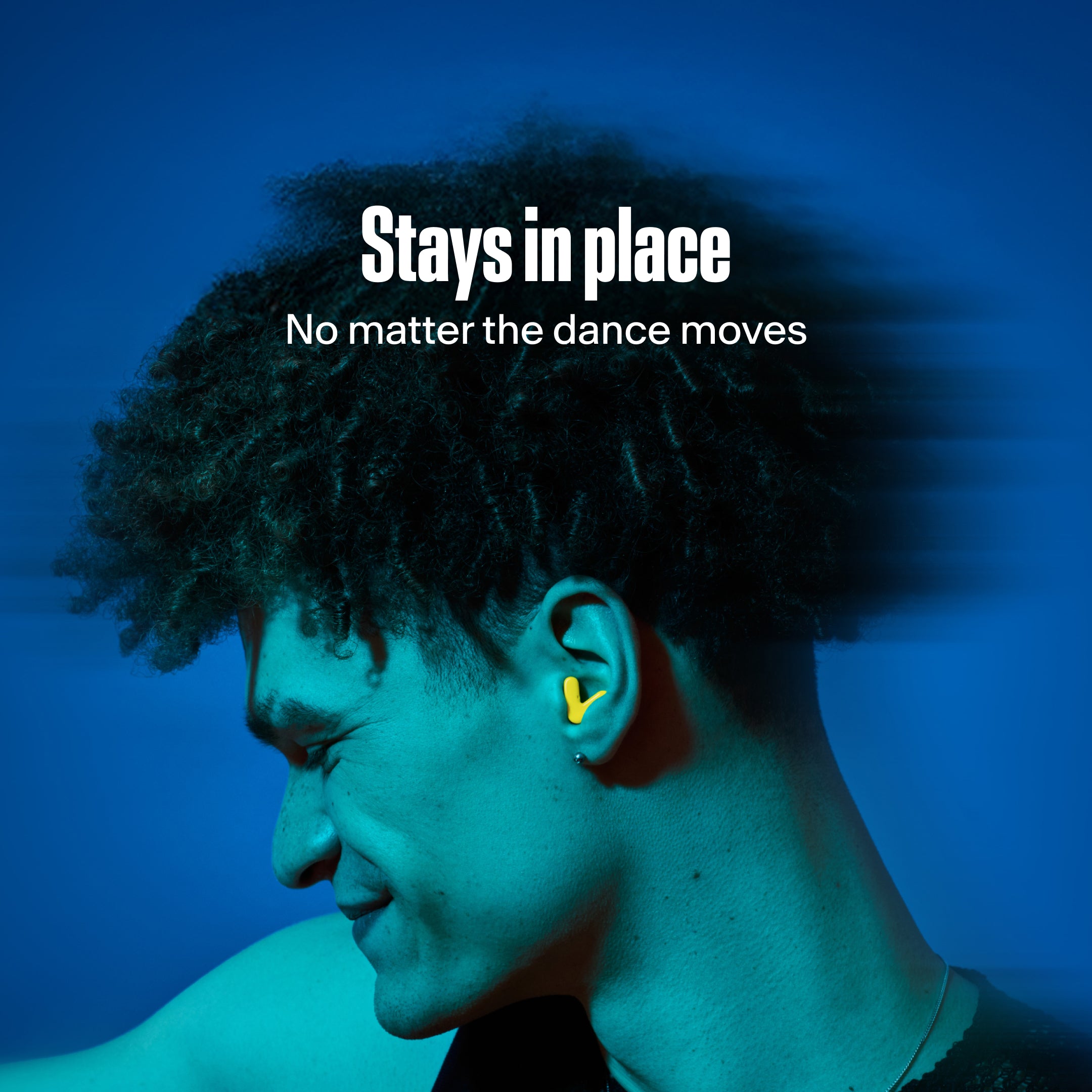 Man wears Alpine Tune in neon-yellow while dancing 