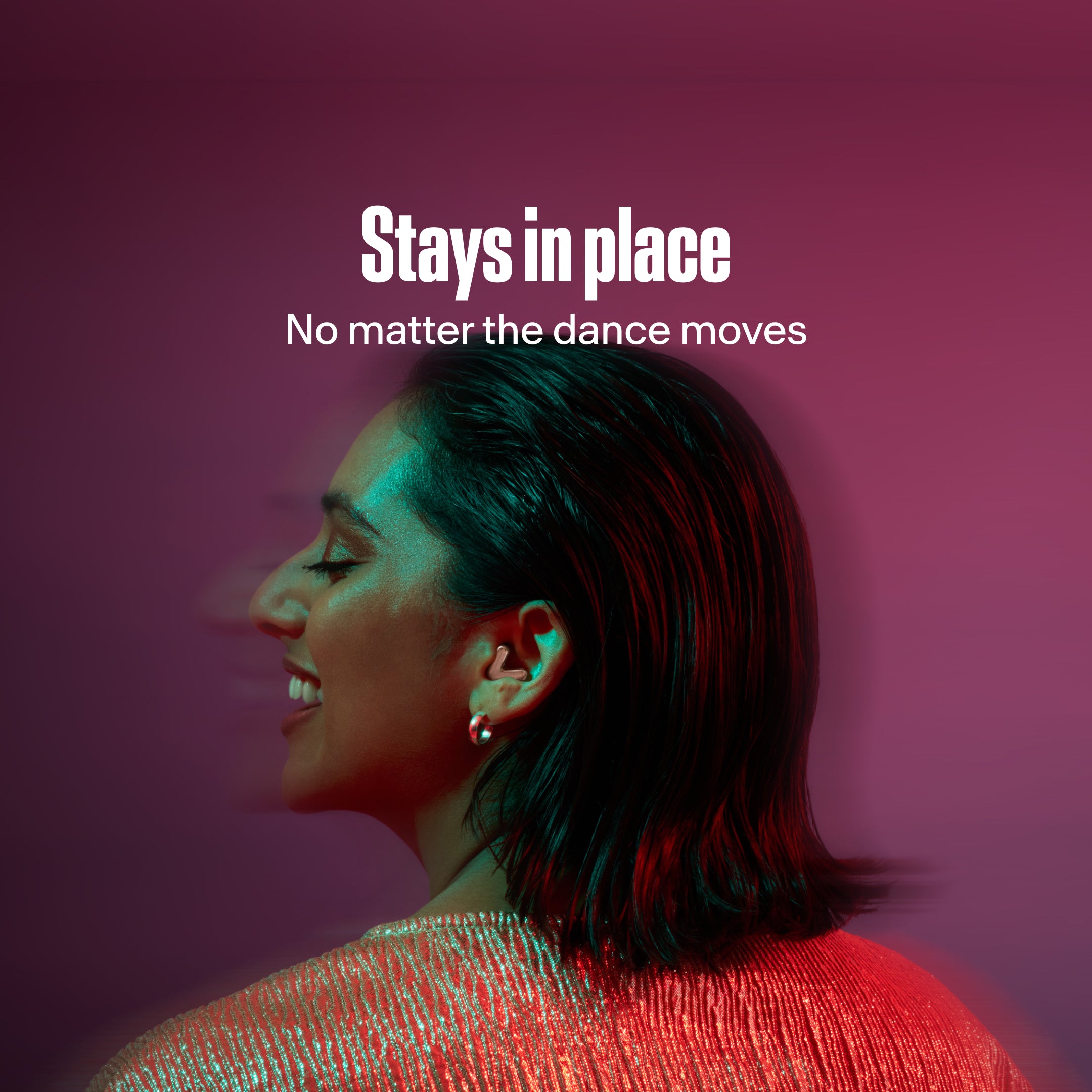Woman wears Alpine Tune in rose-gold while dancing 
